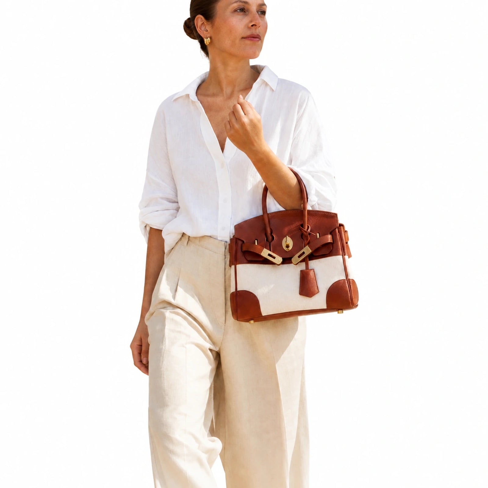Velantra Delphine in Light Chocolate, carried in the crook of the arm