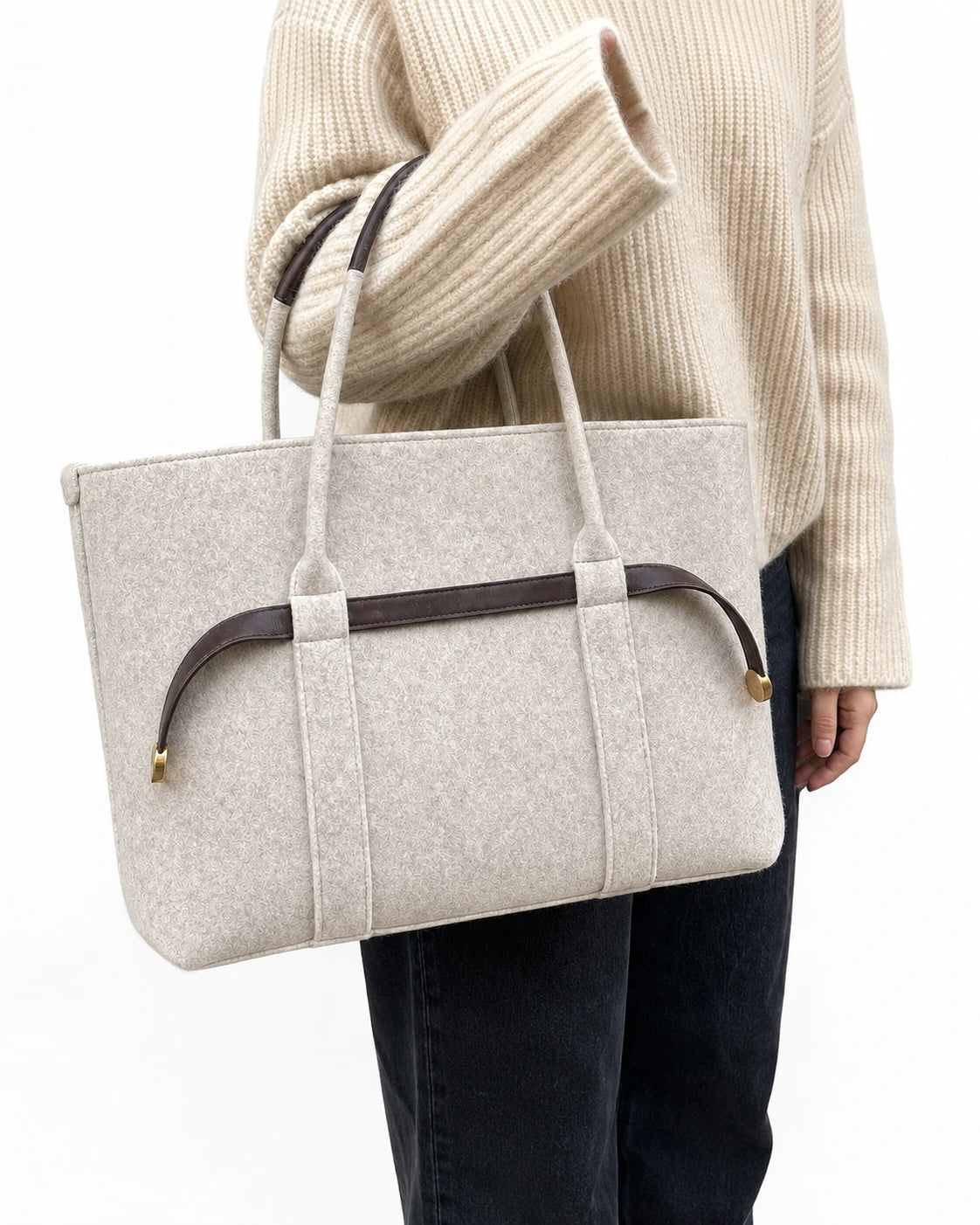 The Colette Wool Tote in Espresso carried on the forearm