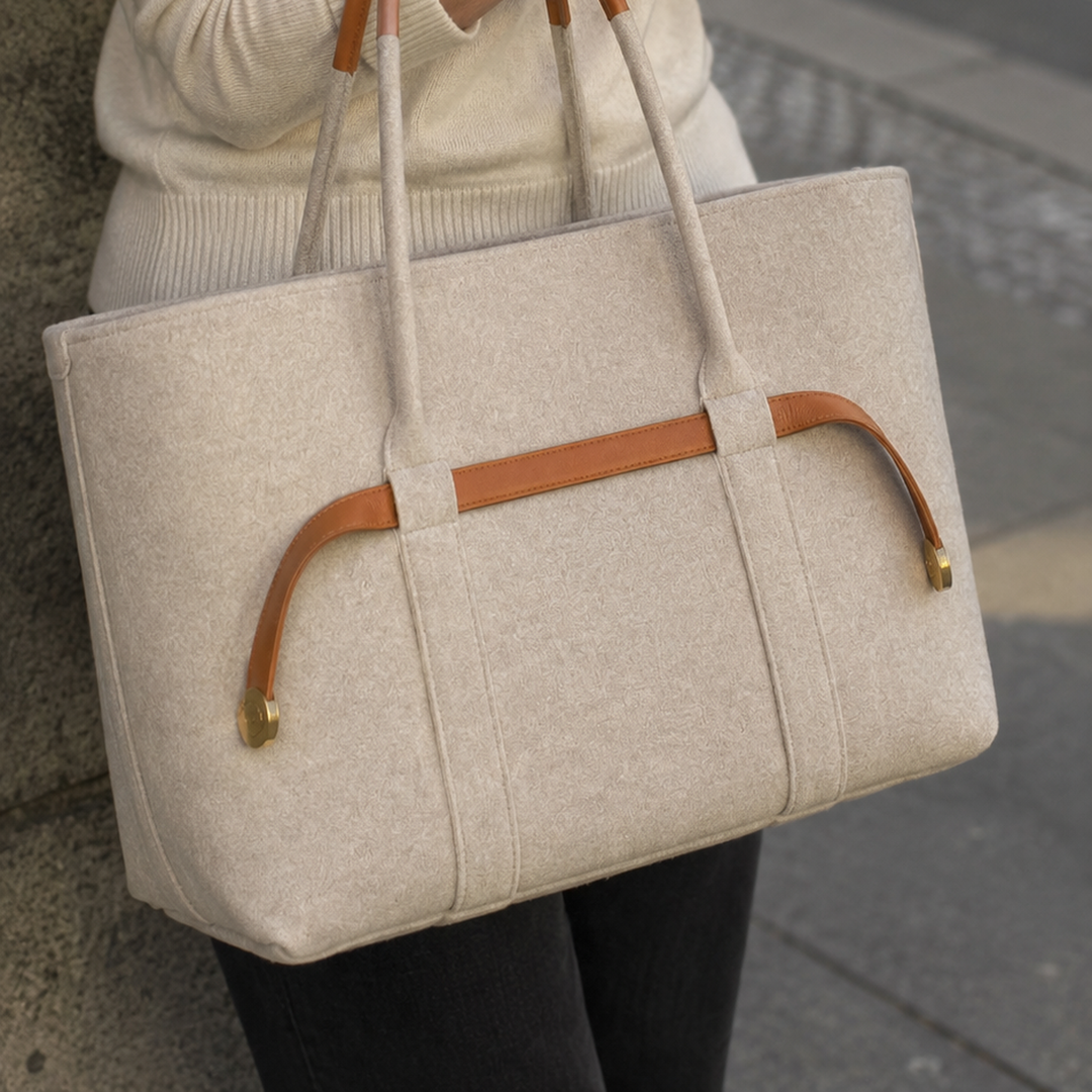 The Colette Wool Tote in Caramel carried on the forearm 