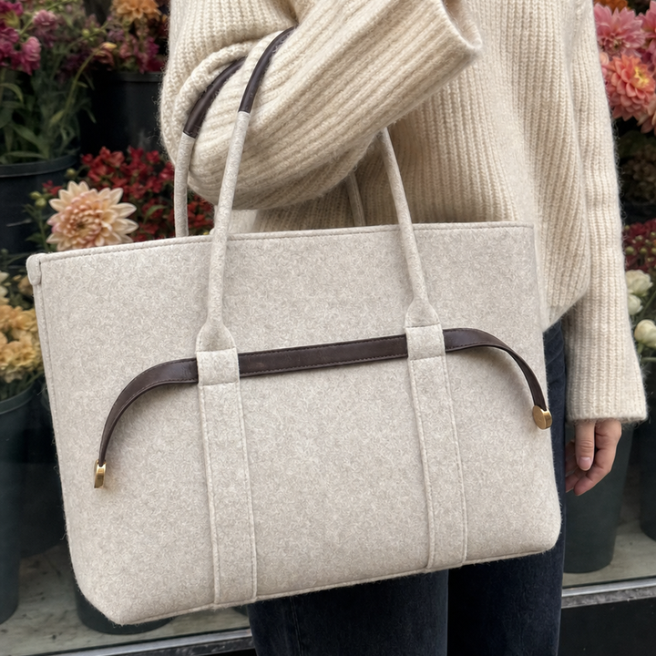 The Colette Wool Tote in Espresso carried on the forearm 