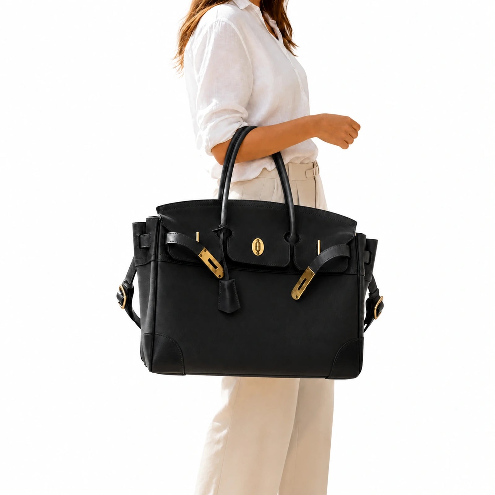 The Velantra Weekender in Black carried on the forearm