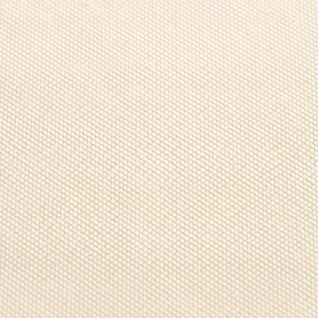 Close-up of the Camille Navy tote’s cream canvas weave.