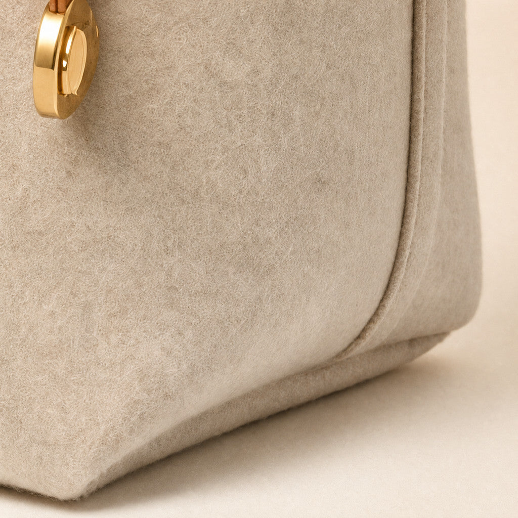 Close-up of the Colette’s felt side gusset and curved lower edge.