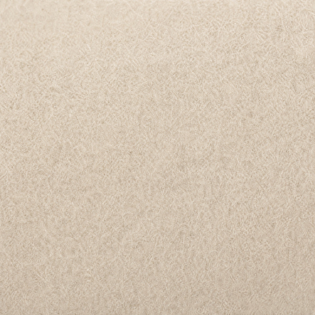 Close-up of the Colette’s pale felt-like surface and short matte fibers.