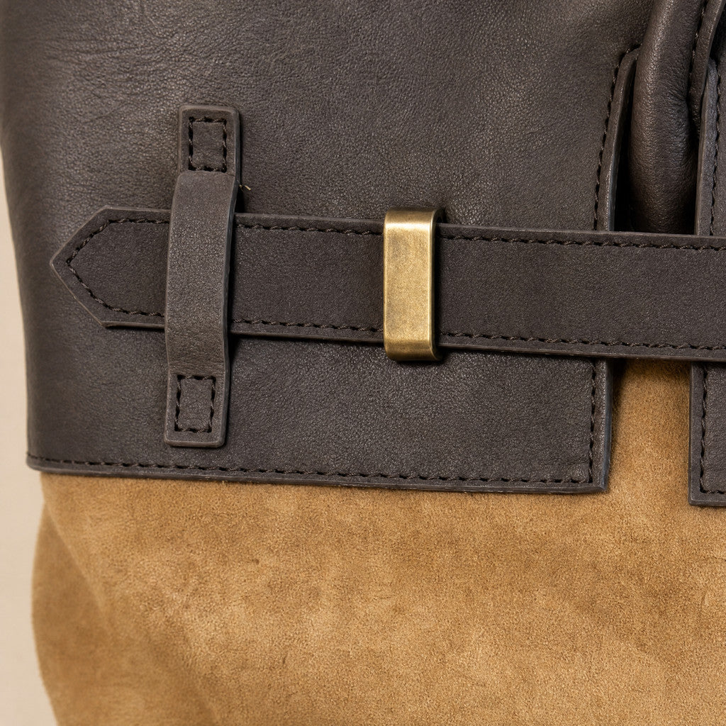 Detail of the Juliette’s dark leather collar seam against Camel suede.
