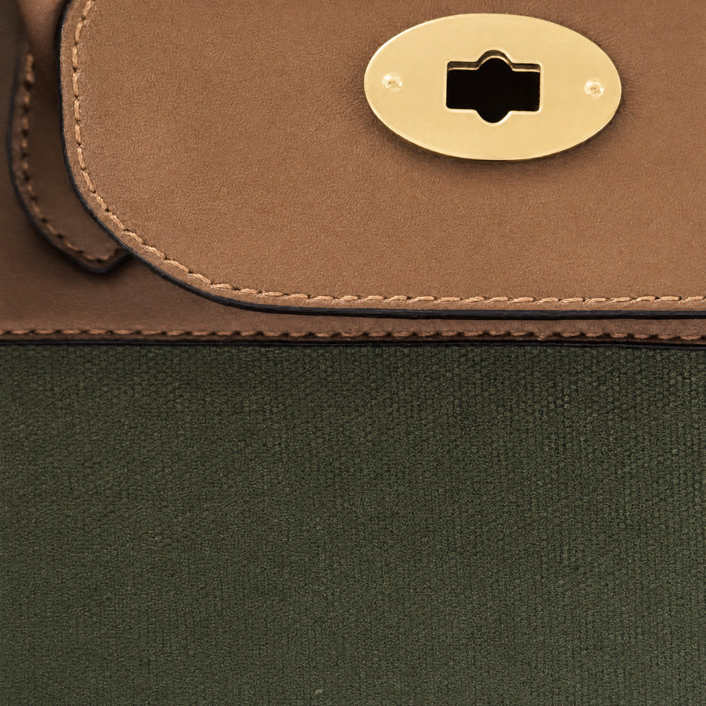 Detail of the Eleanor Weekender’s contoured leather flap and tonal edge stitching.