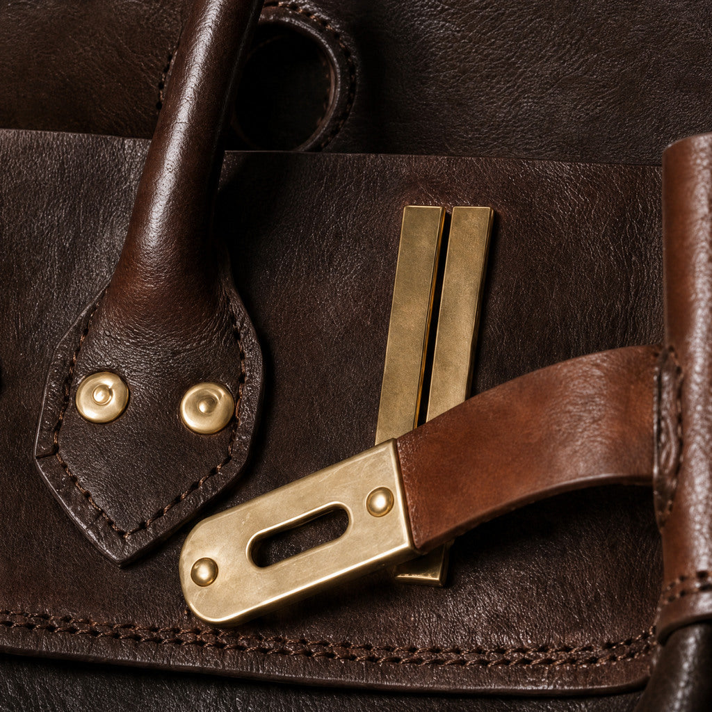 Detail of the Vivienne’s finished handle attachment, tonal stitching and gold rivets.